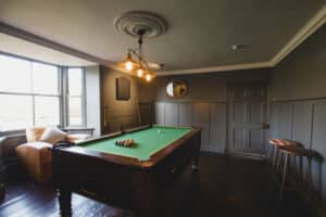 MAKE YOUR AIRBNB STAND OUT WITH A FULLY STOCKED GAME ROOM